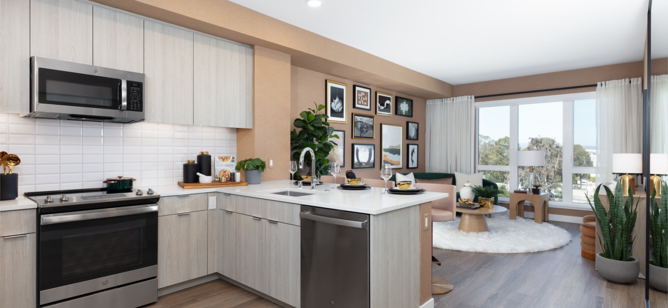 Kitchen Spacious and well lit kitchen with wood floors and stainless steel appliances